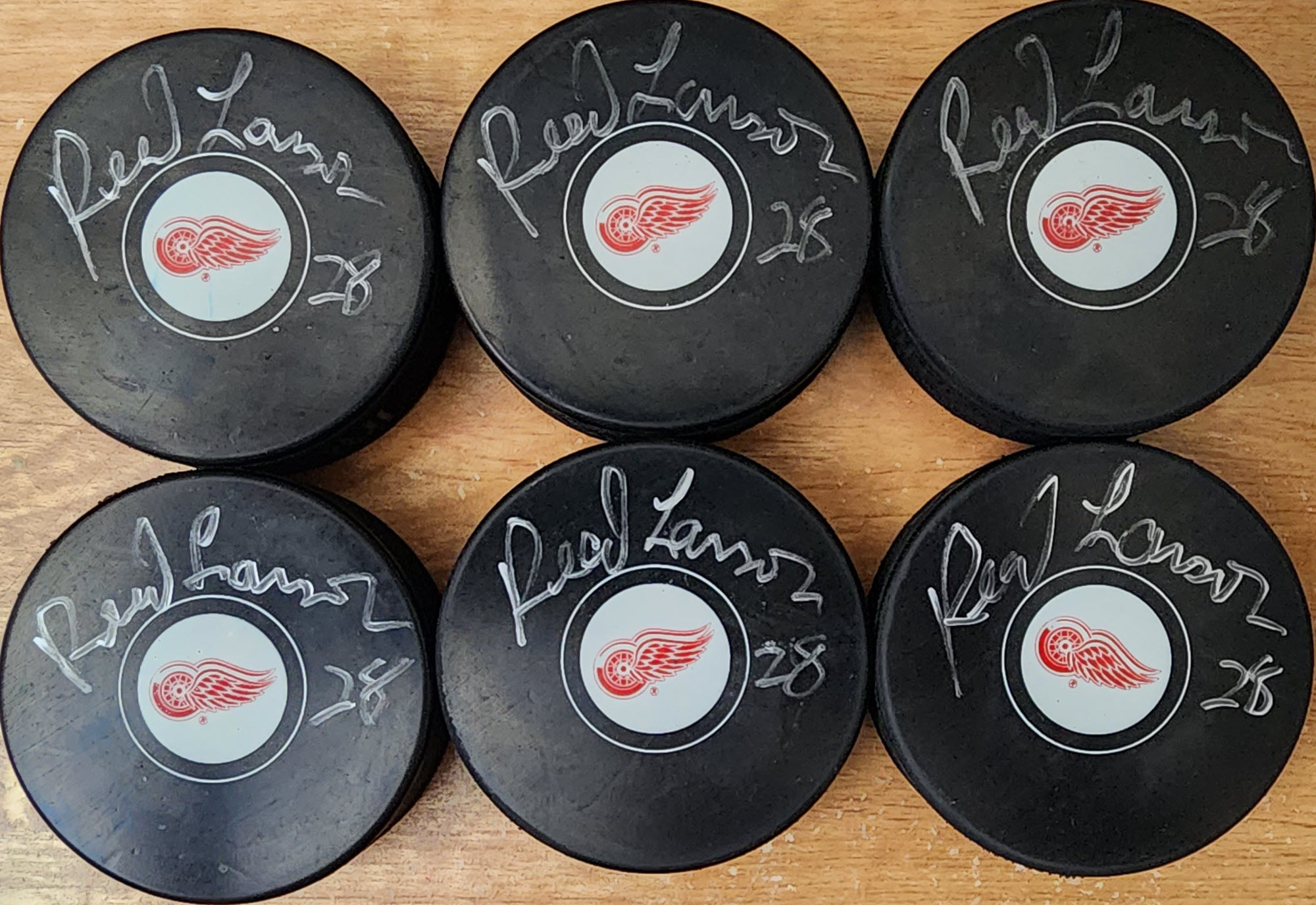 Reed Larson Detroit Red Wings Autographed Pucks